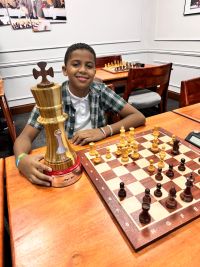 Caribbean Chess Academy reconoce a Ángel Lara por su impresionante empate en el 3er lugar en el Campeonato Mundial Escolar de Ajedrez FIDE en Perú.
